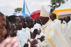 Bishop Odoki while welcoming each of the new Priests to Arua Catholic Diocese with a hug on Saturday.