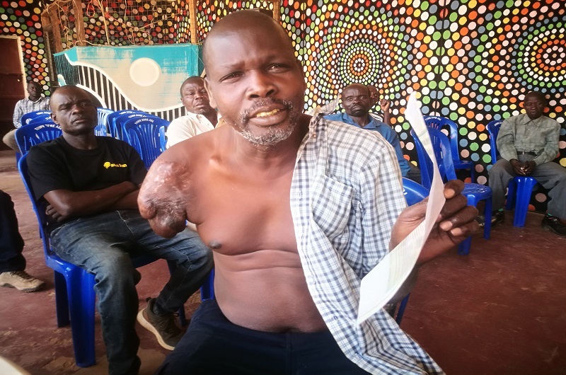 Chiriga speaks while holding some of his documents during an earlier meeting organized by the members.