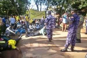 Police block some members of Kony war victims during an earlier demonstrating at Arua City Mayors Garden in June 2022.