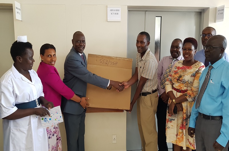 Prof. Okong-(3L) Symbolically Hands Over the ICT Hub to Dr. Asiimwe at Arua RRF on Wednesda