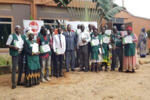 Some participants Post Bank and FSME officials join Ichogor C in a group picture shortly after the closure of the training on Thursday.