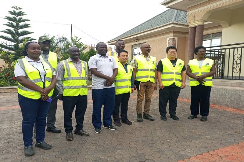 UNRA staff pose for a group photo with Zhongmei Engineering Group officials shortly after the press conference on Friday. Photo Credit Andrew Cohen Amvesi