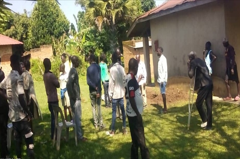 Residents of Buraa cell gather at the home of Late Eriaga on Tuesday morning (last week) to see the huge hole dug by the gunmen in search of mercury and uranium