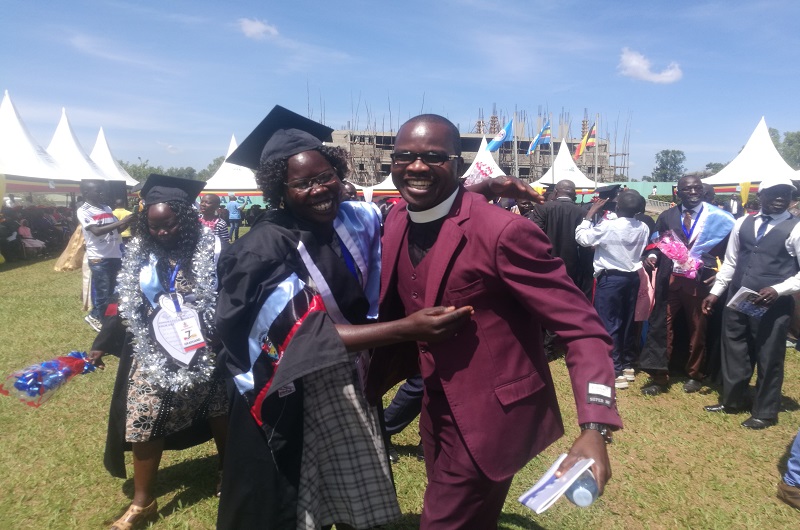 A graduate being congratulated by her relative during the graduation ceremony on Saturday. 