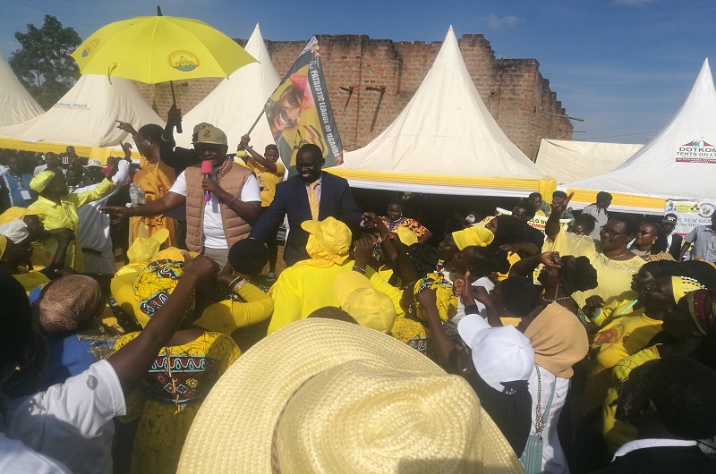 Hon. Kangwagye joins MP Atima in fundraising on Sunday. At the background is the incomplete Ojulua Chapel. Photo Credit_Andrew Cohen Amvesi