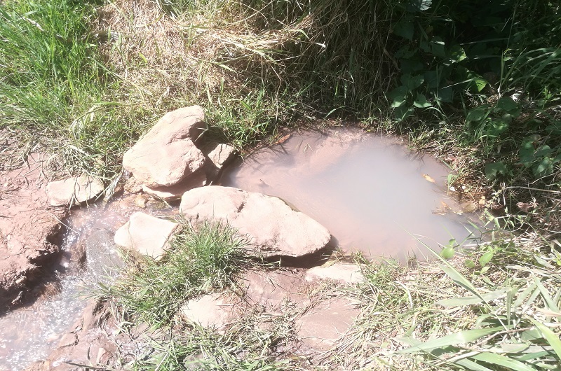 One of the shallow wells locals used to rely on in Nyori village before the construction of the piped water system. Photo Credit_Andrew Cohen Amvesi