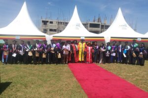 The Muni University students who got First Class pose for a group photo with officials during the graduation ceremony on Saturday