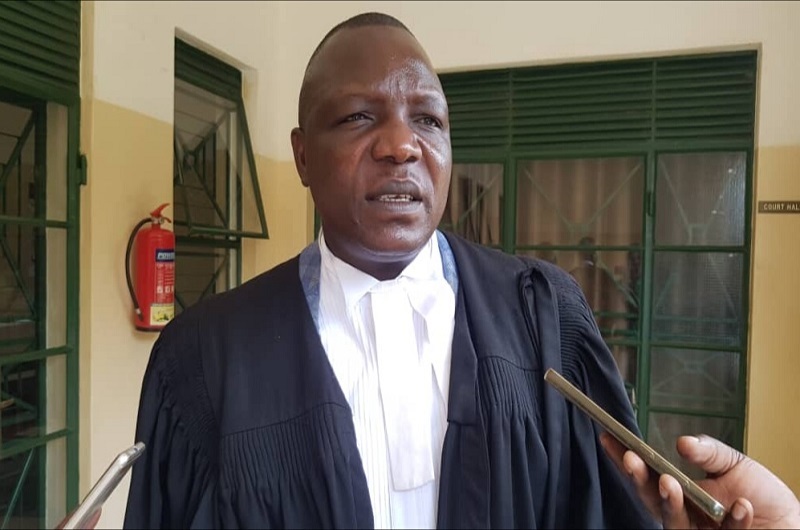 Samuel Ondoma, the Lawyer of the defendant speaking to journalists at Arua High Court
