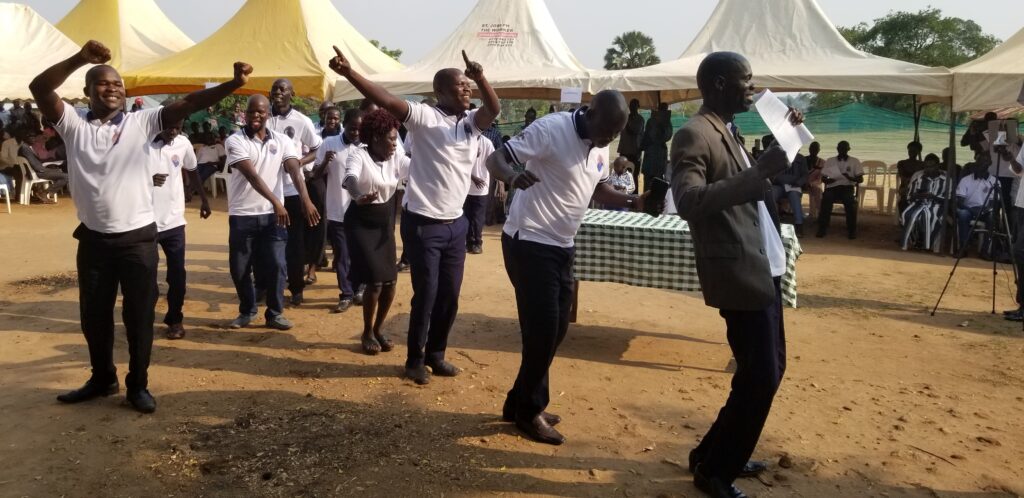 Nyarakua PS teachers led by their headteacher Abaku dance in excitement on Sunday