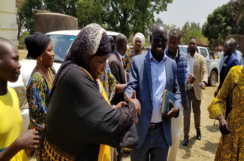 West Nile Effort for Museveni members led by Chandia line up to welcome MPs Atima and Ayume on Monday