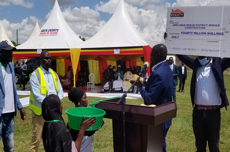 MP Atima hands over the Shs40m cash towards the construction of Irishad Complex Mosque