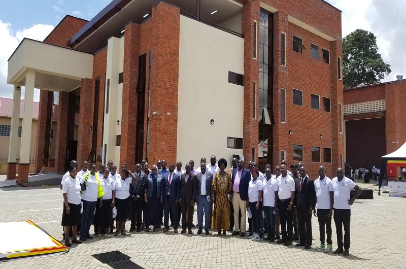 The EC staff in West Nile join their former staff, Electoral Commissioners and Justice Byabakama for a group photo on Monday