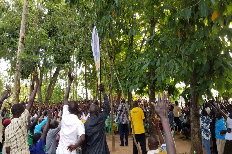 Locals raising hands in support of Atiku's come-back at Adumi on Thursday. Photo Credit Andrew Cohen Amvesi