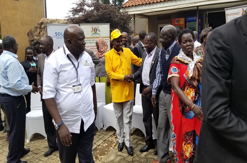 Sam Wadri Nyakua (in yellow shirt and cap) having a light moment with Rasul Ayimani, the new ACDF President at Desert Breeze Hotel on Wednesday