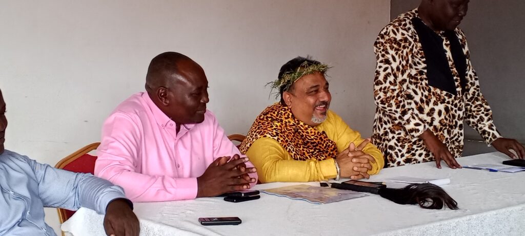 Hon. Tanna having a light moment with Teso Sub-region delegates shortly after the meeting