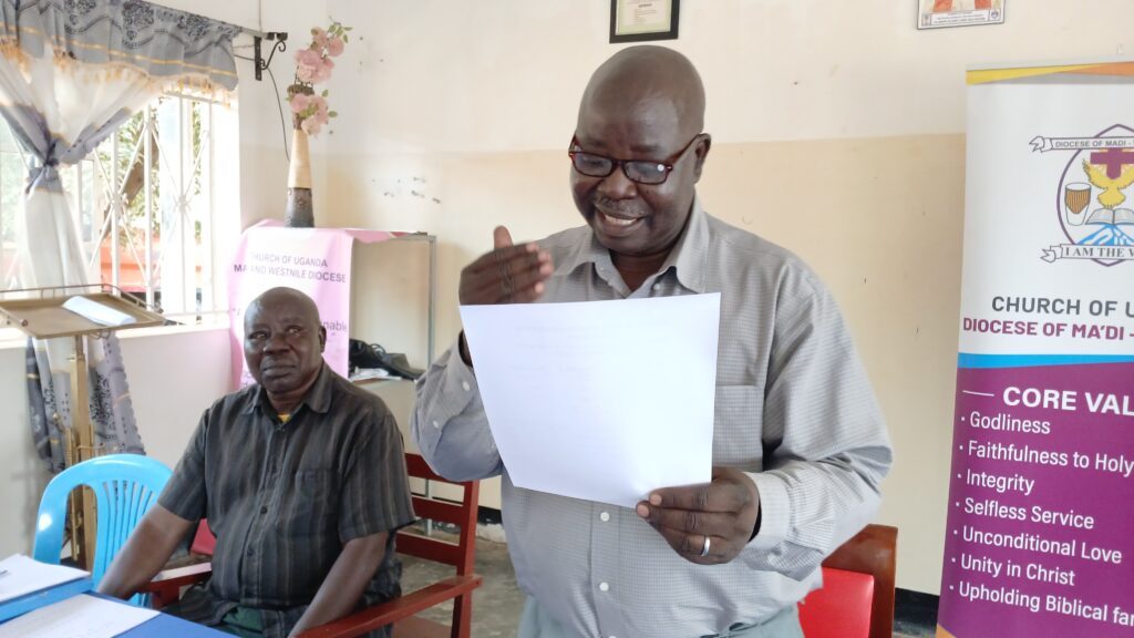 The diocesan Inspector of schools, Robert Ezama, giving report on the Pre-mock