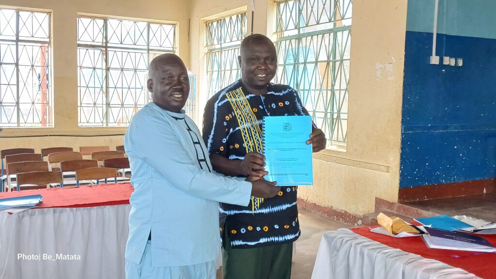 The WENIPSHA Chairperson Ben Candiga handing over the result report to the chief guest