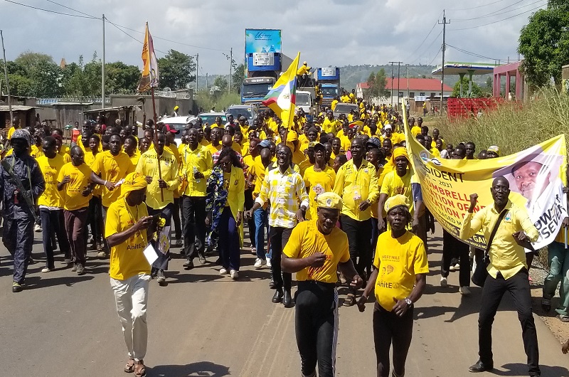 Minister Anite while marching to President Museveni's rally venue with the crowd she mobilized in Nebbi.