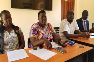 Drate (2L) stresses a point as Angudubo (2R) and Avako (L) looked on during the press conference. Photo Credit Andrew Cohen Amvesi