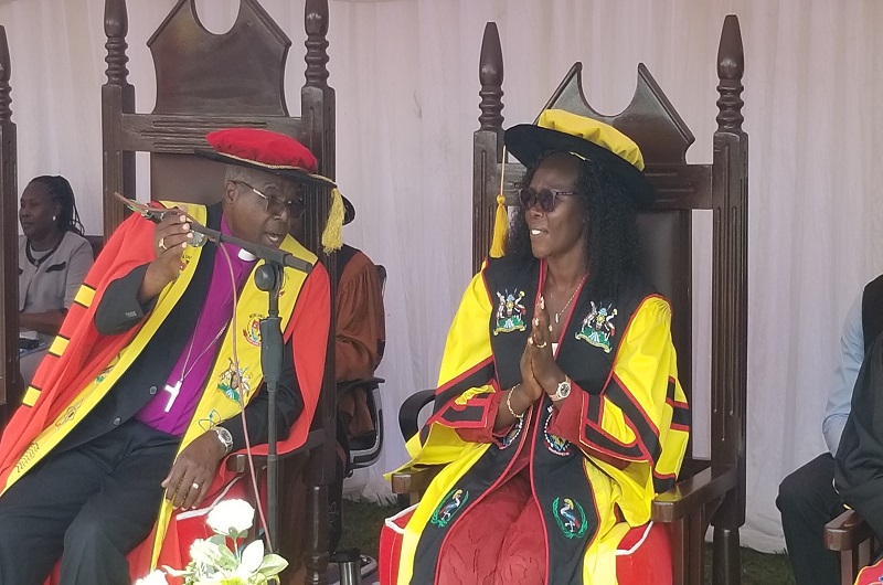 Minister Anite shares a light moment with retired Archbishop Orombi during the graduation ceremony on Saturday