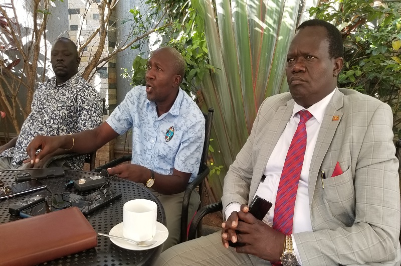 Nandala addresses journalists as Fungaroo (R) and Muzaid (L) looked on