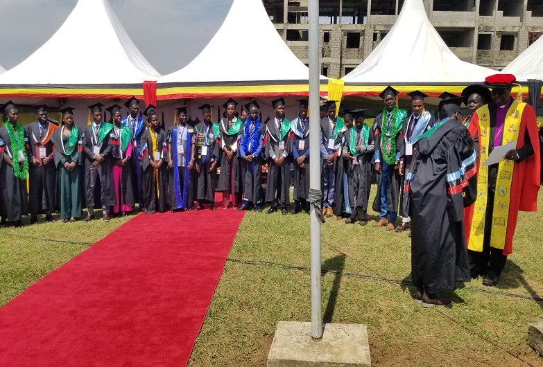 Orombi awarding certificates to First Class students during their graduation on Saturday
