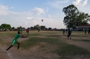 A player of Nyiovurra prepares to head the ball during the quarterfinal game they won against Alivu Ward FC on Sunday. Photo Credit, Andrew Cohen Amvesi