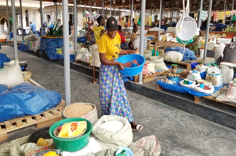 Apio doing her work in the market. Photo Credit, Andrew Cohen Amvesi