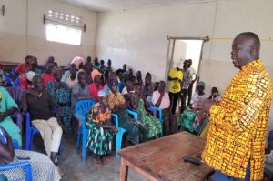 Atiku Benard speaking to the PWDs in Pajulu on Sunday. Photo Credit, Andrew Cohen Amvesi