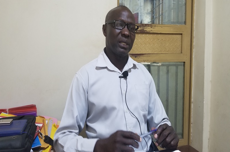 Joseph Amandua speaking to journalists about the market in his office. Photo Credit, Andrew Cohen Amvesi