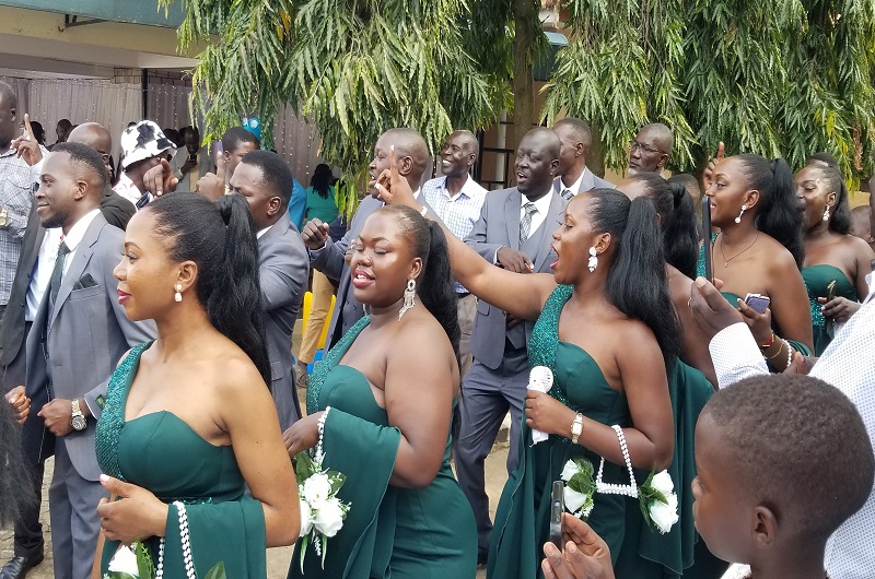 The groom and bride's team making a grand entry in to Heritage Courts Hotel where the couple hosted their wedding reception on Saturday. Photo Credit, Andrew Cohen Amvesi