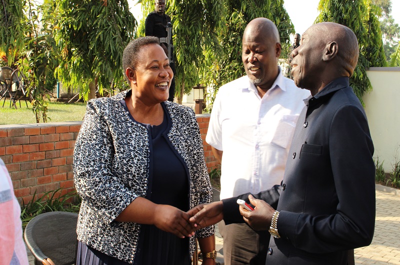 Minister Babalanda having a light moment with some officials shortly after day one training in Arua on Wednesday.