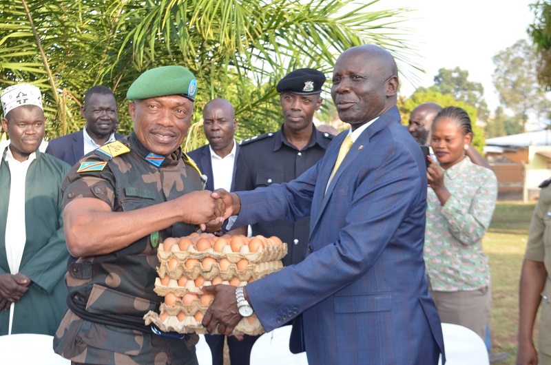 RDC Ayikobua gifts Col. Disanoa with trays of eggs on Friday. Photo Credit; Andrew Cohen Amvesi