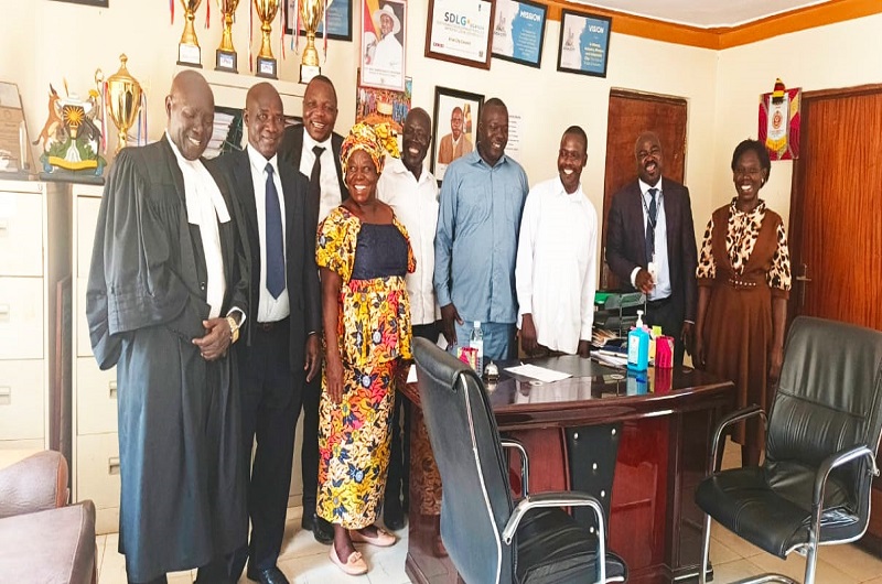 The new and old Arua City Land Board members having a light moment with the City Officials shortly after their swearing in on Wednesday