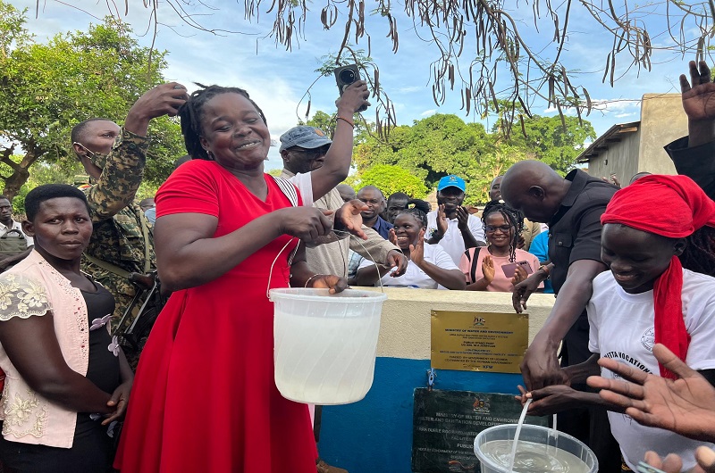 Excited residents fetching water at a newly constructed public stand in West Nile last week.
