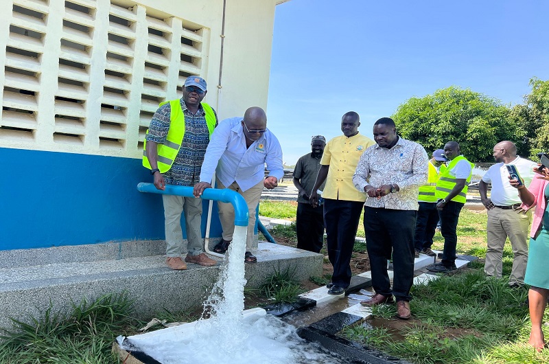 Officials join Eng. Matua (L) in commissioning one of the water facilities in Lobule Sub-County, Koboko district last week.