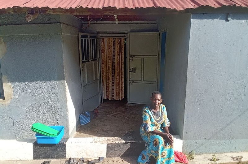 Candiru seated infront of a room temporarily given to shelter her at Miracle Revival Pentecostal Church in Arua City. Photo Credit; Andrew Cohen Amvesi