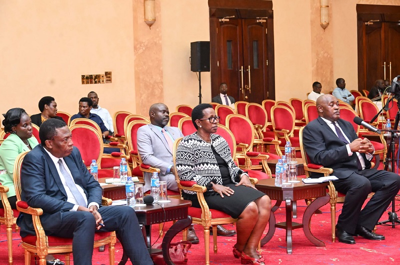 Dr. Baryomunsi (seated R) and Dr. Atwine (C) during the Presidential address on Ebola at State House on Wednesday. COURTESY PHOTO