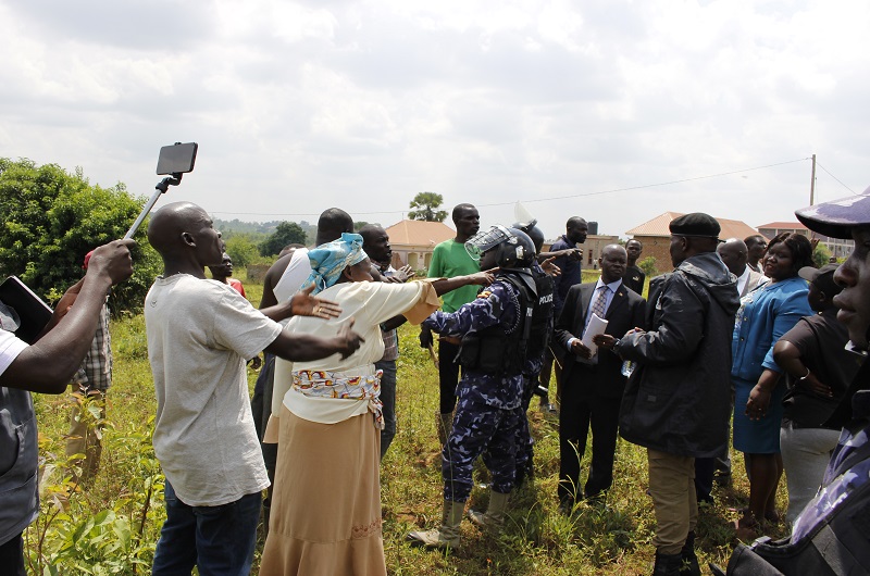 The aggrieved residents of Ayibiri cell trying to resist the locus visit exercise on Tuesday