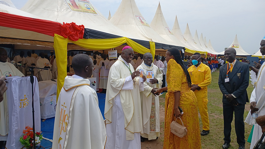 The Maracha District Woman Member of Parliament, Hon. Jennifer Driwaru, sharing light moment with Arua Catholic Bishop Sabino Ocan Odoki on Saturday Photo Credit Matata Bezamin