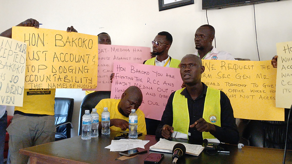 The disputed group comprising central division NRM leaders, Bodaboda riders and supporters, with placards issuing statement on the alleged missing money Photo by Matata Benzamin