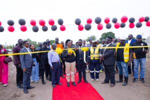 The team led by the Minister Nyamutoro and Euro Gold cutting ribbon during the launch.