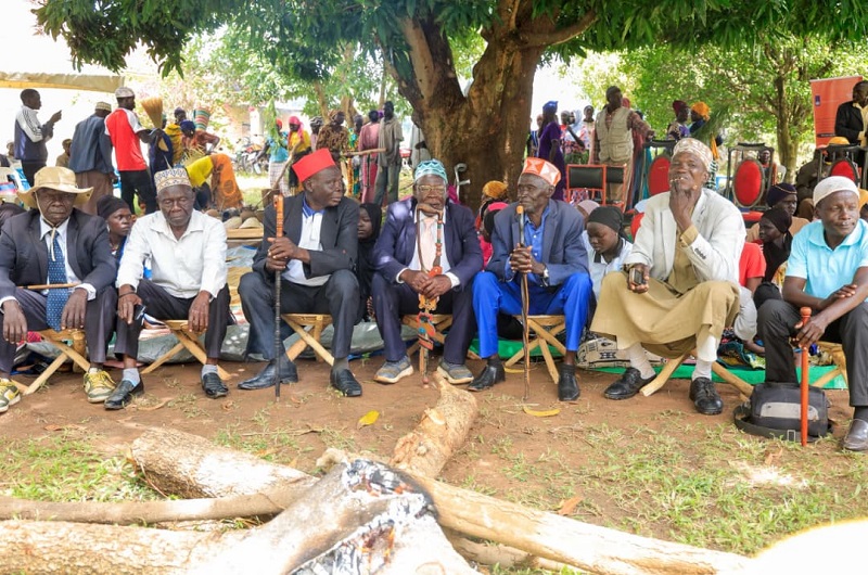 Aringa Kingdom officials seated near the fire place during the function in Yumbe district