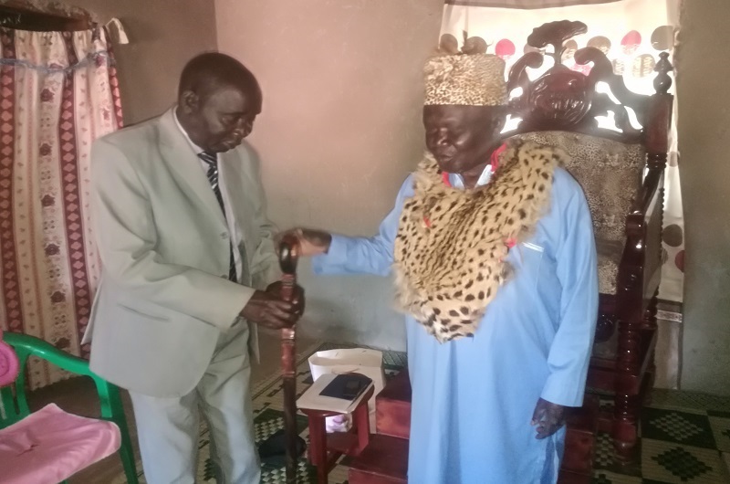Ejiku (L) hands over a cultural walking stick to His Highness shortly after his declaration as the Paramount Chief. FILE PHOTO