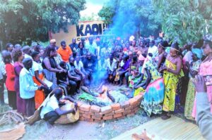 Sections of Alur youth and elders gather around the fireplace at Pawong Chiefdom in Alur kingdom as a way of restoring lost culture. Photo Credit; Innocent Kisa
