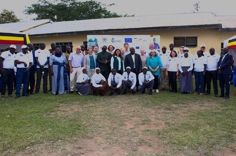 Some students of Yumbe SS joined officials from EU, KfW, MoWE, MoES, Yumbe district and other stakeholders in a group photo shortly after the commissioning exercise on Tuesday