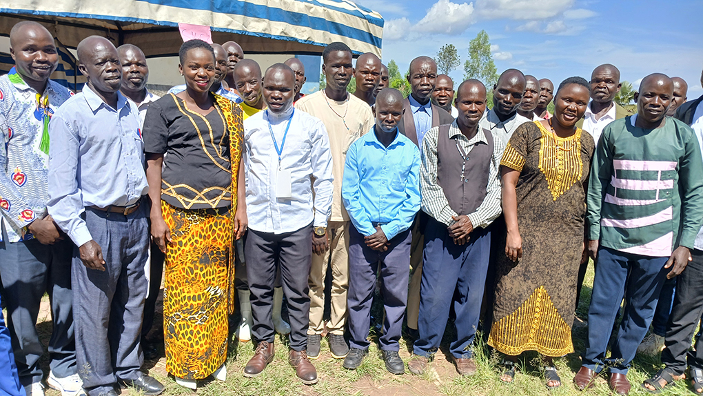 The two Legislators, Hon. Mourine Osoru (Left) and Hon. Phiona Onzima (Right) in a group photo with the local leaders Photo by Matata Benzamin