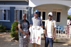Bishop of Madi West Nile Diocese, Rt. Rev. Charles Collins Andaku (Right), Moses Obeta COC chair (Middle) and Bilha Angualiru (Left) in a frame. Photo by Matata Benzamin