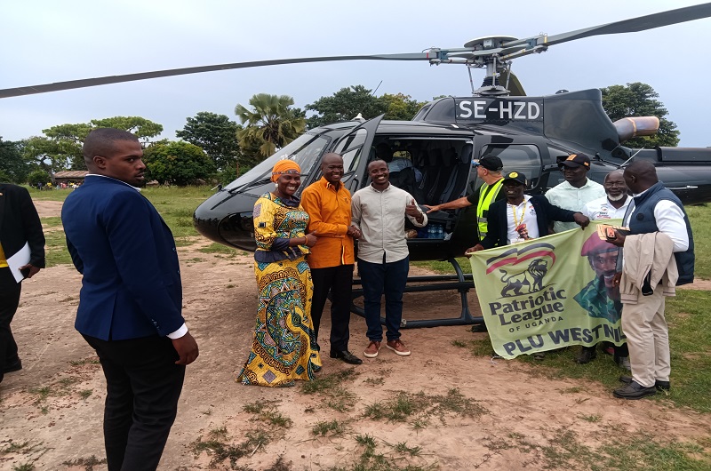 Hajjat Medina poses for a photo moment with Hon. Kabanda and other officials at Koboko Airfield  on Wednesday